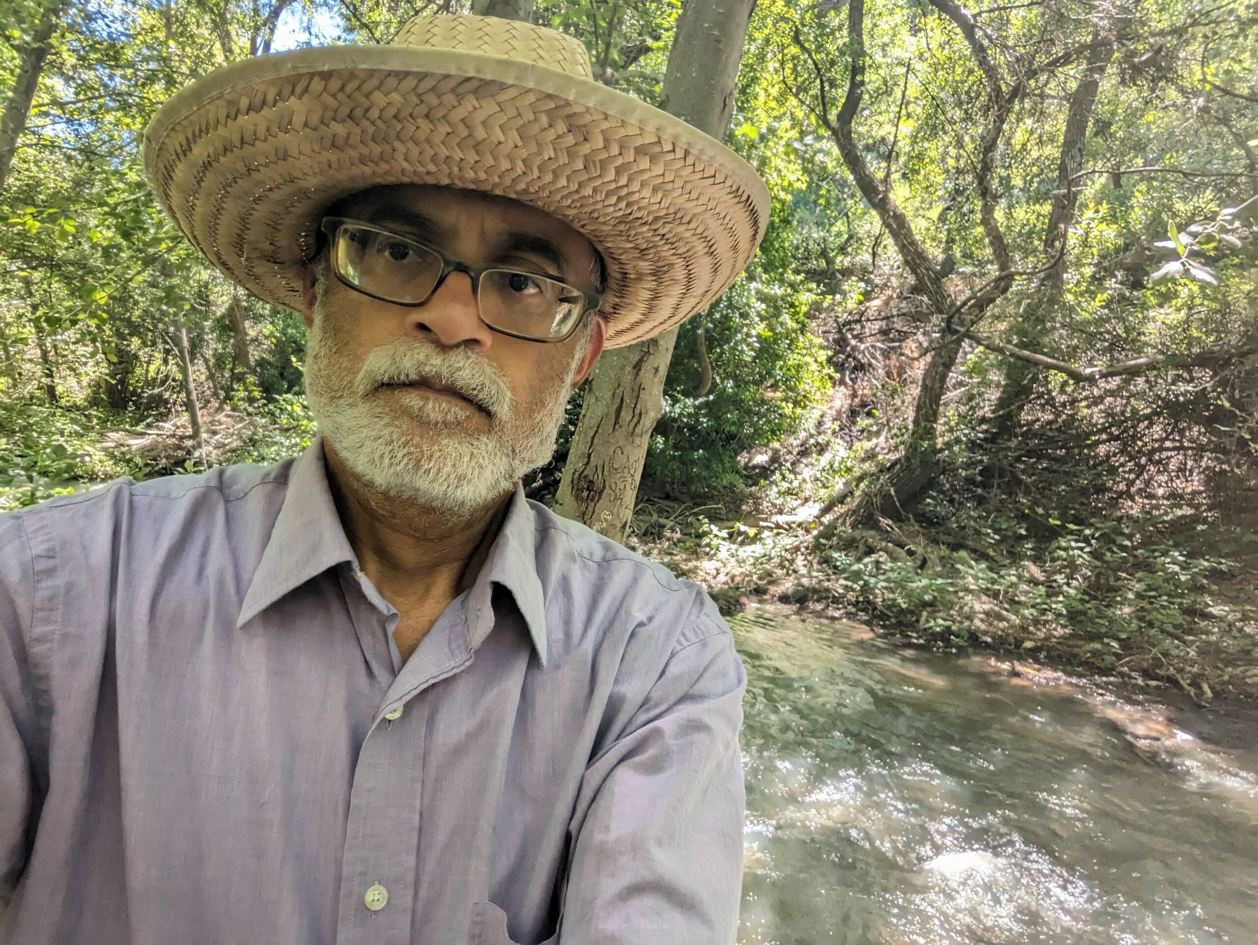 A man wearing a hat in an outdoor setting